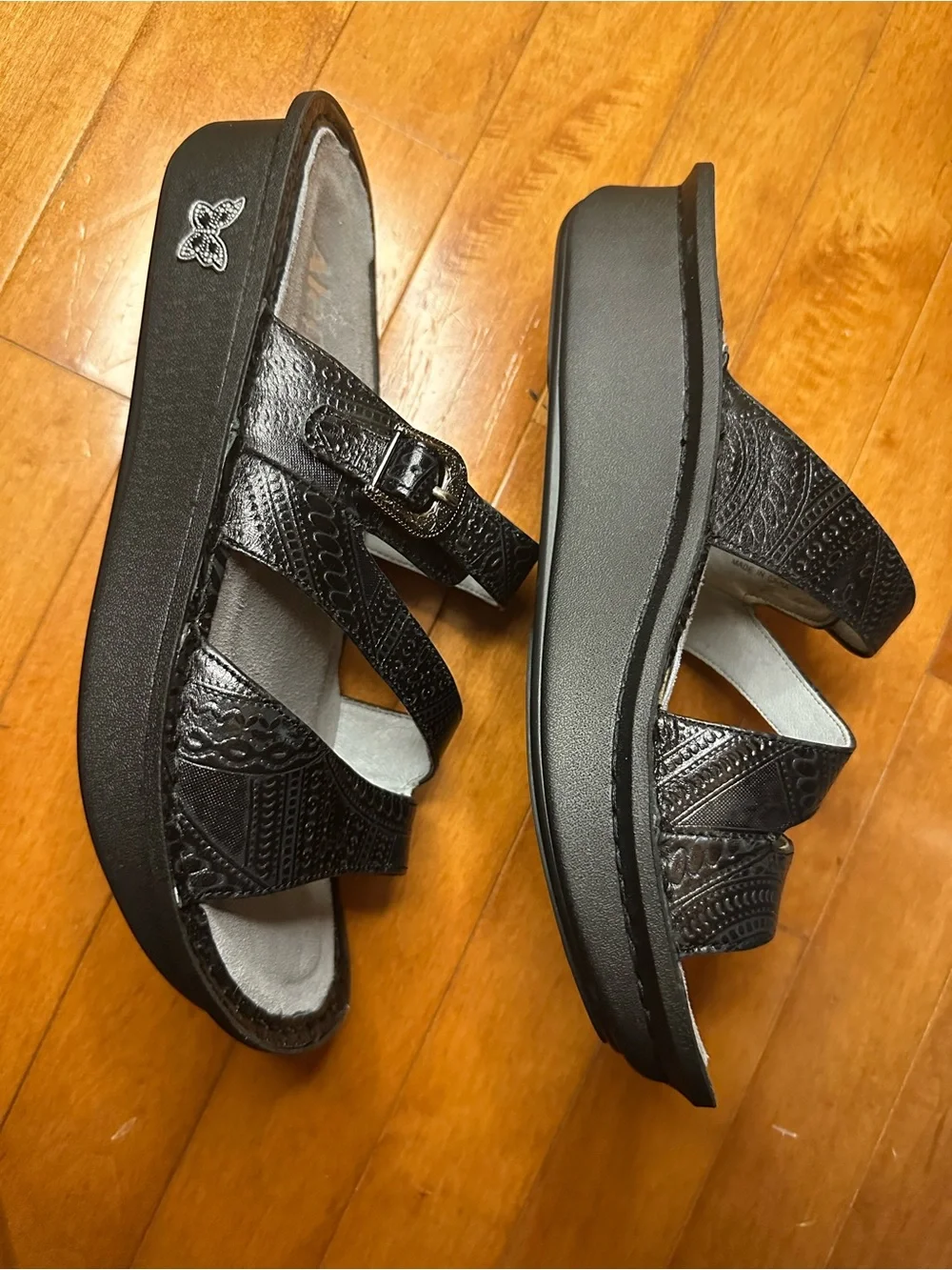Alegria Black Embossed Leather Slide Sandals with Decorative Medallions